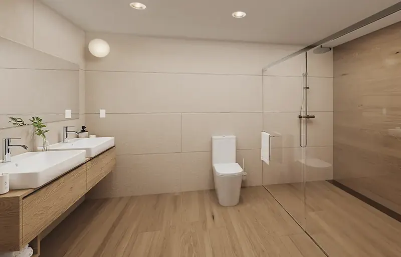 Bathroom with a double washbasin on oak cabinets and a glass walk-in shower