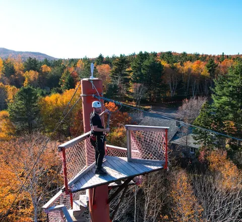 Zip-line platform above autumn forest