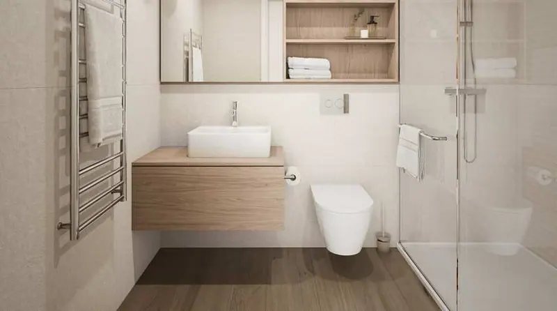 Bathroom with a walk-in shower and a double washbasin