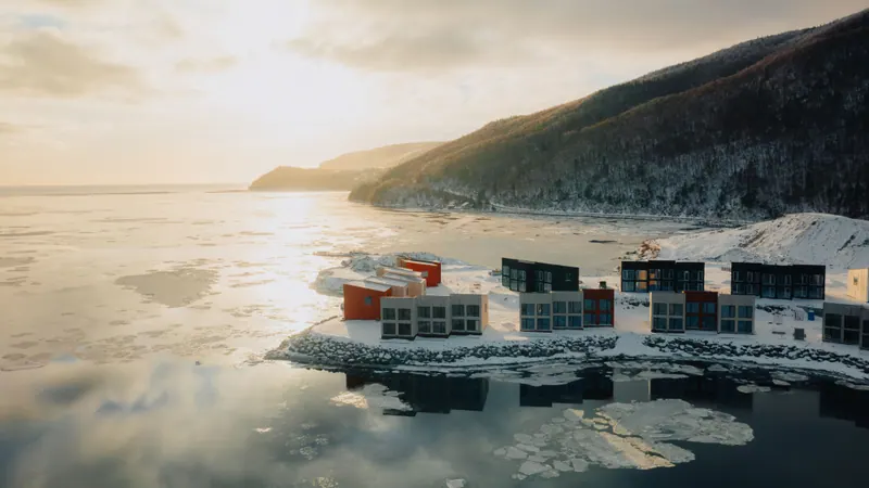 Cormorant Rock chalets on the shore at dusk