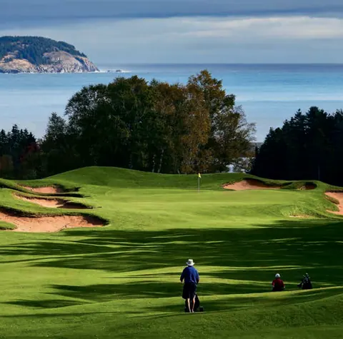 Golf green on the coast with the ocean behind