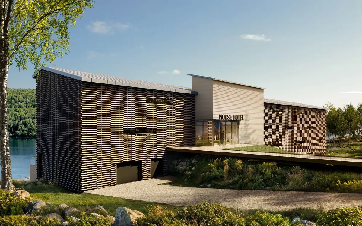 Architectural rendering of the Moose Hotel with a timber-slatted facade beside a lake