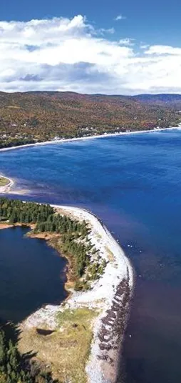 Aerial view of the Highlands Links golf course along the bay and Ingonish Beach