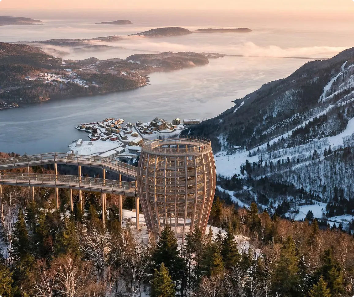 Rendering of the Mi’kmaw Basket Tower lookout above the forest and the bay at sunrise