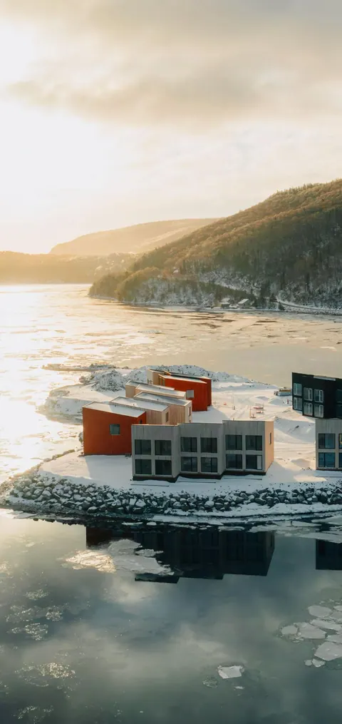 Cormorant Rock chalets on the rocky shore beside the Atlantic