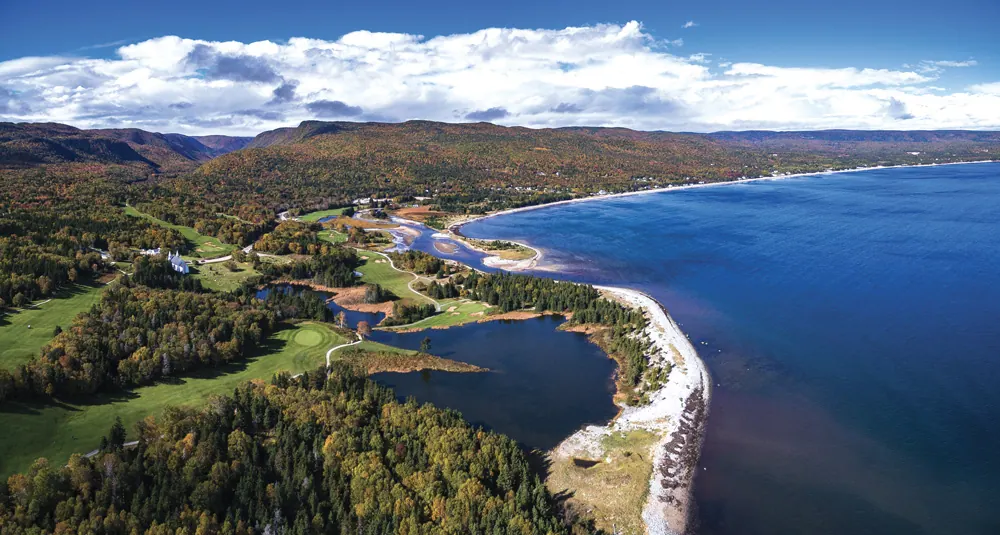 Aerial view of the Highlands Links golf course along the bay and Ingonish Beach